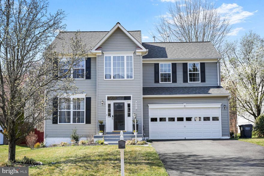 This stunning three-level single-family home offers over 3,600 sq. ft. of meticulously finished living space. Upon entry, you're greeted by a grand two-story foyer with soaring ceilings and gleaming. Recent upgrades include fresh paint throughout, the chef’s kitchen boasts modern stainless-steel appliances, sleek porcelain tile, and elegant quartz countertops. A bright sunroom/breakfast nook off the kitchen provides direct access to a spacious two -level deck, perfect for outdoor dining or relaxation.

Convenience is key with a washer and dryer located on the bedroom level. The luxurious master suite features a spa-like bathroom and an expansive walk-in closet. The fully finished basement includes a large recreation room, two versatile bonus rooms, and a full bathroom—ideal for entertainment or additional living space.

Nestled in a peaceful cul-de-sac, this home is perfectly located near shopping, dining, state and national parks, the public library, commuter lots, and places of worship, offering the ideal balance of privacy and accessibility