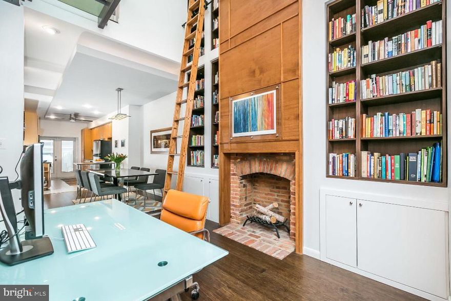 Welcome to one of Federal Hill's most architecturally unique and beautifully designed homes. As if that weren't enough, you will love the parking for 2-3 cars! 1226 S. Charles has a sophisticated design and fully open concept desired by today's most discriminating buyers. The home is like no other, boasting a variety of unique and wonderful features. Meticulously designed and gut-renovated, you'll appreciate and be amazed by the unique architectural elements. Highlights include CitiQuiet soundproof windows which supplement double hung windows and provide both sound attenuation and energy efficiency. Additional beautifully designed elements include a two-story library with a UV-protected skylight which brings natural light into the home. The striking library is complemented by a custom 13' rolling ladder and 7 built-in bookcases and custom cabinetry. Elegant wood paneling graces both the living room and library bringing warmth and sophistication to the home. An exceptional steel bridge with glass flooring and cable rail runs across the second level and serves as a centerpiece of the home. The living room, dining room, and kitchen are enhanced with dropped ceilings which include tray lighting creating a lovely ambiance. There are so many more features including a spacious rooftop deck where you'll enjoy city and stadium views, 2 wood-burning fireplaces, gorgeous contemporary full baths, walk-in closets,fabulous soapstone countertops, bamboo floors and a neat garage door providing for secure parking and outdoor versatility! Low property taxes due to an existing CHAP credit provides value. You must see this home to fully appreciate its beauty and all that it offers -- make a private appointment today!