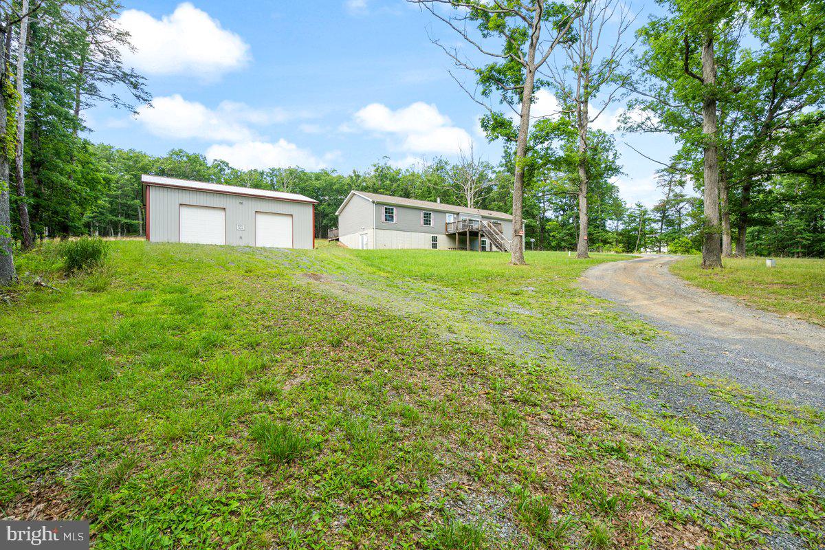 If you are looking for privacy, wooded views, and a spacious home. This one is for you! Sitting on well over 5 acres, this rancher has wooded views to enjoy from the front porch or oversized back deck. All of the bedrooms are extremely spacious with a remarkable amount of closet space! Need more room- the unfinished basement is ready for your customization. And don’t forget that GARAGE- oh man! Wether you are tinkerer, gear head, car enthusiast, or need room for all of your toys- there is room for it all! Schedule your showing today!