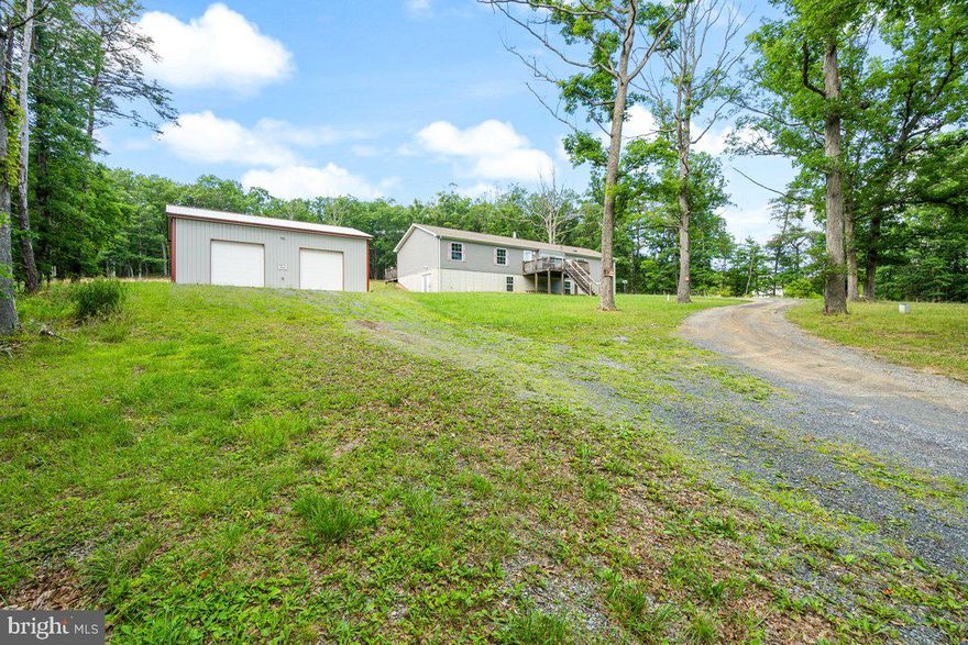 If you are looking for privacy, wooded views, and a spacious home. This one is for you! Sitting on well over 5 acres, this rancher has wooded views to enjoy from the front porch or oversized back deck. All of the bedrooms are extremely spacious with a remarkable amount of closet space! Need more room- the unfinished basement is ready for your customization. And don’t forget that GARAGE- oh man! Wether you are tinkerer, gear head, car enthusiast, or need room for all of your toys- there is room for it all! Schedule your showing today!