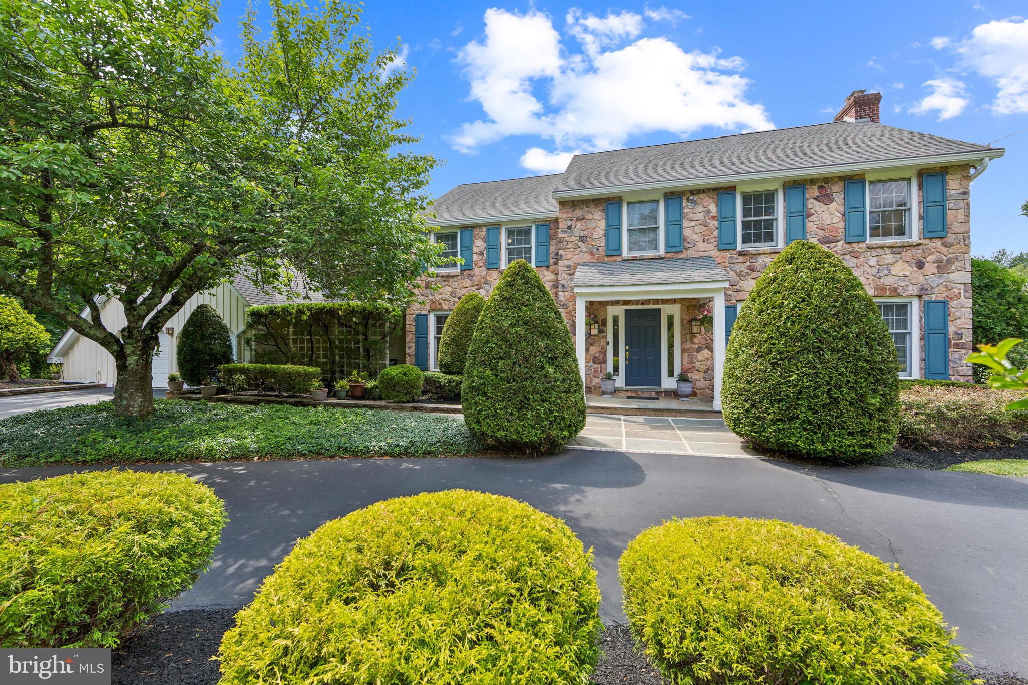 Prestigious Stone Colonial in Gwynedd Valley
Nestled on 1.26 acres of beautifully landscaped grounds, this distinguished Stone Colonial offers privacy, elegance, and modern convenience in the highly sought-after Gwynedd Valley.. Crafted with enduring quality (including a Steel “I” Beam) and attention to detail, this home’s strong architectural bones create a refined foundation for luxurious living. A circular driveway leads to charming flagstone walkways, setting the tone for timeless curb appeal. The long driveway may accommodate at least 7 cars. There is also a separate paved area for shooting hoops or other recreational play. Oversized 2 car garage with plenty of storage.
Step into the grand two-story entrance foyer, welcoming you into spacious and refined living areas. The expansive living room, anchored by a cozy wood burning fireplace, which has the potential to be converted to gas as hook-up installations are present in the basement, is perfect for gatherings, while the formal dining room provides an ideal setting for entertaining.
The remodeled custom kitchen reflects a chef’s gourmet eat-in kitchen showcasing designer cabinets, high-end quartz countertops, stainless steel appliances, gas cooktop, title backsplash, generous oversized kitchen island and pantry space. The adjoining breakfast area features a beautiful French door and a relaxing backyard. The kitchen flows seamlessly into the large family room, where a second fireplace (also with gas connection in basement for easy conversion) adding additional warmth and character. The gleaming hardwood floors throughout the first floor elevate the home’s charm and add a touch of refinement.
For entertainment, enjoy the game room, an entertainer’s delight. The pool table and wet bar make for fun times, creating the ultimate space for hosting guests.
The second floor boasts four generously sized bedrooms. The primary bedroom has a renovated en-suite spa like bath with soaking tub, double sinks with high-end quartz countertop and a large walking shower. All bathrooms on the second floor are remodeled showcasing programmable heated floors. There is also an additional storage room, ensuring ample space for every need.
Functionality meets peace of mind with a three-zone HVAC system, two separate gas water heaters, and a security system for added safety. A Standby Generator System ensures uninterrupted power, while the new gutter system with leaf filters keeps maintenance effortless. Additionally, the home features two Hydraulic Emergency Sump Systems as backup protection.
An unfinished basement awaits your personal touch—perfect for customization to suit your needs and vision.
Located within the highly desirable, Award winning Wissahickon School District, this exceptional home is also convenient to shopping, dining, including the iconic William Penn Inn and major routes. Easy access to RT 309 / RT 276 / Pa. Turnpike / Center City Philadelphia. Gwynedd Valley Train Station is only a 5-minute walk from the home. Very convenient for Center City and Airport Transportation.
This home offers you an excellent balance of privacy and convenience in the quiet and renown neighborhood of Gwynedd Valley. Seller providing a 1 Year AHS Warranty.