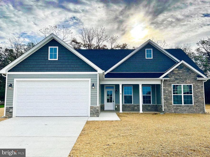 January Delivery! One of our most sought-after single-level home designs is now under construction in Nadenbousch Pines, and this one includes a desirable unfinished basement plus an impressive list of upgraded features.

Step inside to a bright, open living area with cathedral ceilings, oversized windows, and a sunroom that fills the home with natural light and opens to a generously sized deck—perfect for relaxing or entertaining. The spacious primary suite offers a tray ceiling, large walk-in closet, and a well-appointed en-suite bath. Two additional bedrooms feature upgraded ceiling heights and share a stylish hall bath. An attached 2-car garage and concrete driveway provide plenty of convenient parking.

Quality finishes come standard, including LVP flooring in the main living spaces, quartz countertops, soft-close cabinetry, and stainless steel appliances. Every home includes a 1-year builder warranty, 10-year structural warranty, and manufacturer warranties on HVAC and appliances—giving you peace of mind and protecting you from costly repairs. Buy new construction and minimize the surprises!

Located on Lot 59, the last lot on the right at the end of Sanibel Way. Floor plan and lot map are available in the listing photos. Reach out with any questions or contact your agent. There’s still time to choose flooring, exterior colors, and optional upgrades!