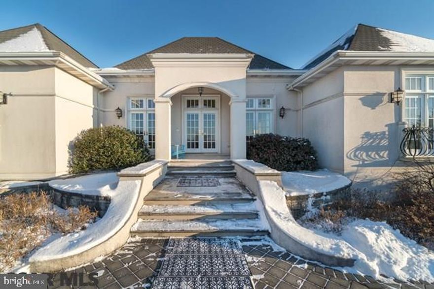 An incredible ranch built to the highest standard by Phil Bosak on a corner lot of 1.23 acres. The front affords gorgeous views looking toward Beaver Stadium and the rear has very pretty views of Tussey Mt. This home is simply incredible with extra high ceilings, graceful archways, ornate wrought iron accents and lots of windows to let in light.  Each of the 4 large bedrooms has a private full bath (2 bedrooms on main floor/2 bedrooms in lower level). The grand Dining Room is huge w/ approx. 14' recessed ceiling & a sparkling chandelier. An extraordinary, large kitchen w/ double ovens & built in wok on gas stove looks to a huge Family Room. GREAT space w/ 4200+ above grade & approximately 2,000 below grade finished. Two-2 car garages (total 4 bays) and a private courtyard in the rear of the home. Laundry on both floors. It is an exceptional home for entertaining. Must see pictures because this brief description cannot convey the beauty.