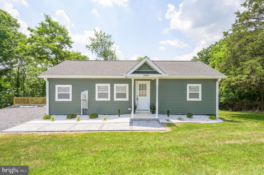 Reduced price to sell now! Discover the charm of this delightful ranch-style home, nestled in a serene rural setting. Built in 1991 and set to undergo a major renovation in 2025, this residence offers a perfect blend of comfort and potential. With 2 spacious bedrooms and 2 full bathrooms, the open floor plan invites you to enjoy seamless living and entertaining. The combination kitchen and dining area is perfect for gatherings, while the country-style kitchen features modern appliances, including a dishwasher, refrigerator, stove, and built-in microwave. Natural light floods the home through double-pane windows, enhancing the warm ambiance. Enjoy the convenience of main-floor laundry and a cozy entry-level bedroom. Step outside to your expansive 0.39-acre lot, where you can unwind on the deck, surrounded by trees and open common areas, providing a peaceful retreat. The partly wooded yard offers a perfect backdrop for outdoor activities or simply enjoying nature. Located just 1 to 5 miles from a commuter rail station, this home balances rural tranquility with easy access to transportation. The gravel driveway provides ample parking, while the sloping terrain adds character to the landscape. Embrace the opportunity to make this inviting space your own, where comfort meets potential in a picturesque setting.