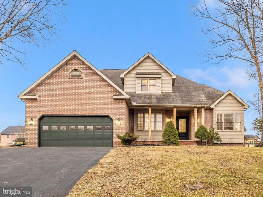 Custom features and elevated design come together to create a truly next-level, magazine-worthy home in the highly desired Penn National community. Step inside and be amazed by soaring 20-foot ceilings, a light-filled great room, and an open floor plan designed for both everyday living and entertaining. Refinished solid oak hardwood floors, crown molding, fresh paint, fresh carpet, new lighting fixtures, and abundant natural sunlight enhance the home throughout. The custom kitchen is a showstopper with quartz countertops, new stainless-steel appliances, a pantry, oversized eat-in island, and a dedicated custom coffee bar, seamlessly connected to the great room by a stunning three-sided gas fireplace. The formal dining room adds an elegant space for gatherings, while the main-level primary suite offers privacy and comfort with a luxury primary bath featuring a separate shower and jetted soaking tub, along with a walk-in closet. Upstairs, three additional bedrooms feature new carpet and share a fully remodeled full bathroom. A finished lower-level family room with an additional gas fireplace provides even more flexible living space, complemented by mountain views, expansive deck space, and a large fenced yard. A home warranty conveying makes this home truly move-in ready.