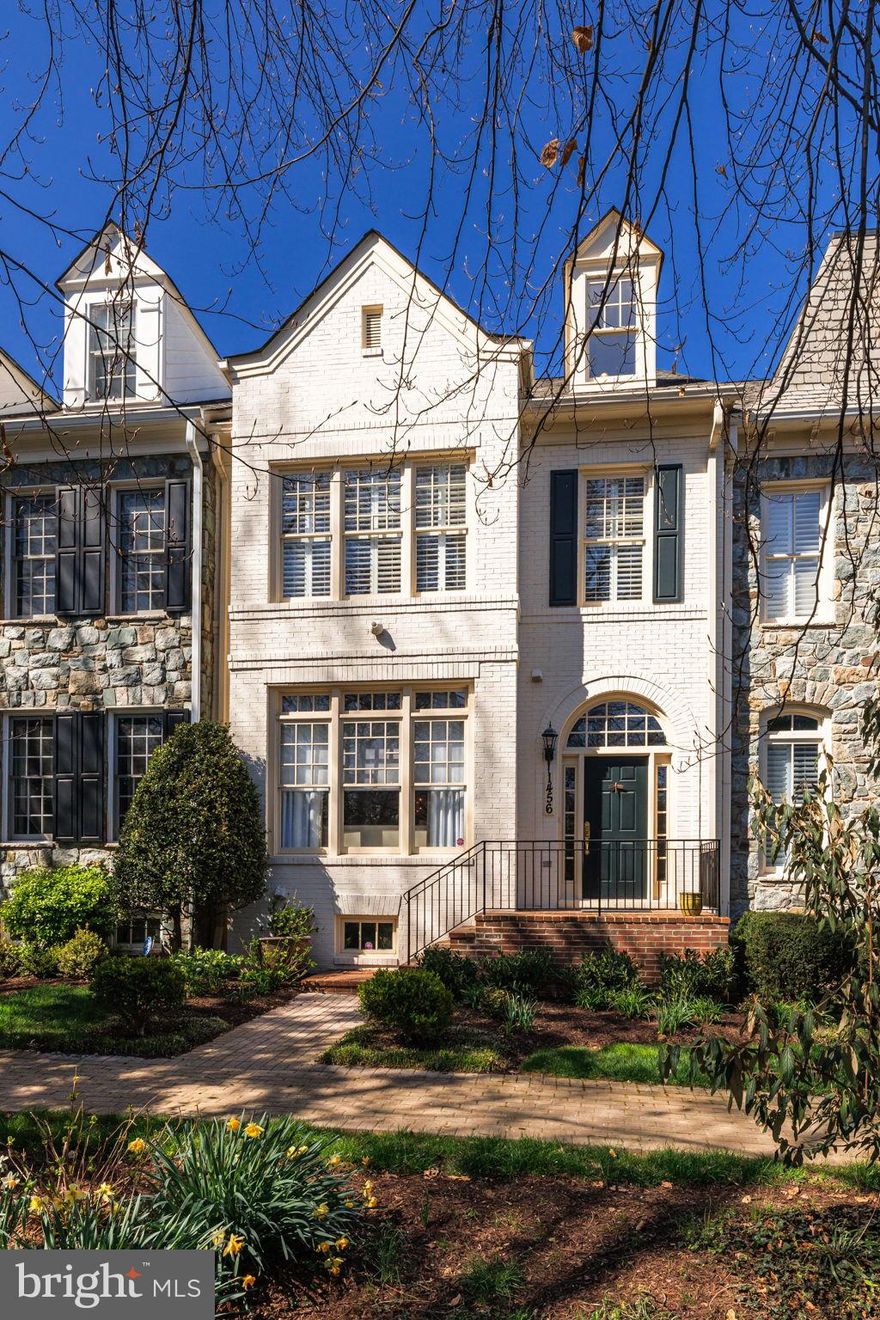 Elegant & stylish 4 story townhouse in the sought after gated community of Evans Farm.  Boasting almost 4,700 sqft, the main level features 10-foot ceilings, extensive architectural details, open floor plan, and a secluded Georgetown patio. The sun-filled formal living room opens to the dining room with striking chandelier. The chef's kitchen with Sub-zero refrigerator and Viking stove, has abundant storage and breakfast bar. The family room with gas fireplace and breakfast area overlook and open to the patio, perfect for al fresco dining/entertaining. Two upper levels with 4 bedrooms provide ample room for family, guests or multi-generational living. The primary suite features two walk-in closets, large sitting area, custom plantation shutters, and spacious bath with double sinks, built-in vanity, separate water closet, tub and shower. Two additional bedrooms w/shared bath and a laundry room complete this level. The loft level has bedroom w/skylight and large dormer, sitting area and full bath.  A separate zoned HVAC keeps it cool in summer, warm in winter. The full basement has extensive storage, an oversized recreation room, full bath, and flex space, great for an exercise room, home office, etc. A framed elevator shaft serves the basement to the second level.   Conveniently located just inside the Beltway and close to the major commuter routes of 495, I-66, the Tollroad, and GW Parkway, make for an easy commute throughout the region.