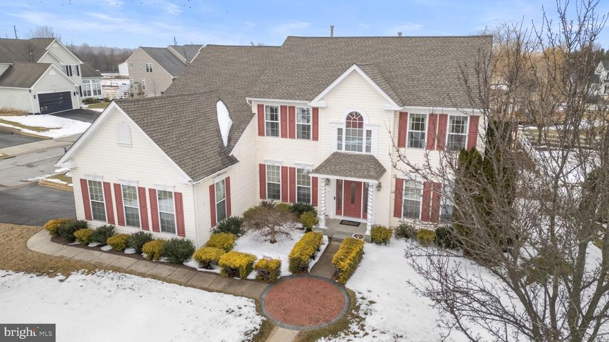 Welcome to 104 Cantwell Drive in the sought-after Cantwell Ridge community of Middletown, located in the Appoquinimink School District and just minutes from major roadways, shopping, dining, medical facilities, and everyday conveniences. This beautifully maintained, one-owner home has been thoughtfully upgraded during construction and enhanced even further over the years. From the moment you arrive, the curb appeal stands out. A new portico and front door, updated porch lighting, and an expansive custom paver walkway frame the home and extend around the property to the mailbox, shed, and basement walk-out. The backyard is designed for both relaxation and entertaining, featuring a large paver patio with steps to the back door and a 20-foot remote-controlled awning with sunshade. Situated on a corner lot, the property is fully fenced with white vinyl fencing and landscaped with arborvitae, crepe myrtles, cherry, holly, and pear trees, along with ornamental grasses. A 24x10 Amish-built shed with electricity, skylights, and a new roof adds exceptional storage and versatility. Inside, a grand two-story foyer with hardwood flooring and oversized windows fills the home with natural light. French doors open to a private office accented with chair rail, and crown molding. while a formal living room sits opposite. The kitchen flows seamlessly into the family room and sunroom, creating an open layout. Features include 42-inch crowned cherry cabinetry with new pull-out shelving in the lower cabinets, a tilt-down panel at the cooktop, new stone backsplash, updated faucet, corian countertops, large island, pantry, recessed lighting, and updated appliances. The step-down family room was expanded with a four-foot bump-out and showcases a floor-to-ceiling stone fireplace with hearth and mantel. The sunroom offers soaring cathedral ceilings, walls of windows, recessed lighting, and direct access to the backyard. The formal dining room is enhanced with custom painted columns and detailed trim work. Additional main-level updates include a new hall bath vanity and added laundry room shelving. The oversized, side-turned 3-car garage features a separate side-yard entrance, built-in shelving, multiple outlet banks including 20-amp service, pull-down attic stairs with added lighting, and reinforced attic joists for substantial storage. Upstairs, four generously sized bedrooms and two full baths provide comfortable living space. The primary suite serves as a true retreat, complete with a spacious sitting area, tray ceiling with recessed lighting, chair rail, two large walk-in closets with custom built-ins, and access to additional finished attic storage as well as floored attic space over the garage. The en-suite bath features a new double vanity with abundant cabinet and drawer storage, tile flooring, a soaking tub, and a separate tiled shower with a new niche and bench seat. The hall bath offers a double vanity and tub/shower combination. Each bedroom includes ample closet space, with one featuring a custom bookshelf and accent wall. The finished basement provides impressive additional living space, including a large room with a walk-in closet that could easily function as two bedrooms, a kitchenette with built-in cabinetry, tile backsplash, and LVP flooring, and a newly added full bath with Italian tile and accessible shower and doorways. There is also a spacious billiards area with exposed beams and recessed lighting, along with a separate workout room that leads to the walk-out backyard. Additional highlights include surround sound in the basement, a whole-home intercom system with integrated audio, RainSoft water softener and filtration system, sump pump battery backup, ceiling fans with remotes in most rooms, and a hall closet outlet. The roof on both the home and shed was replaced in 2023, and the main zone HVAC and A/C system was replaced in 2025. Meticulously cared for and thoughtfully upgraded, this home reflects true pride of ownership