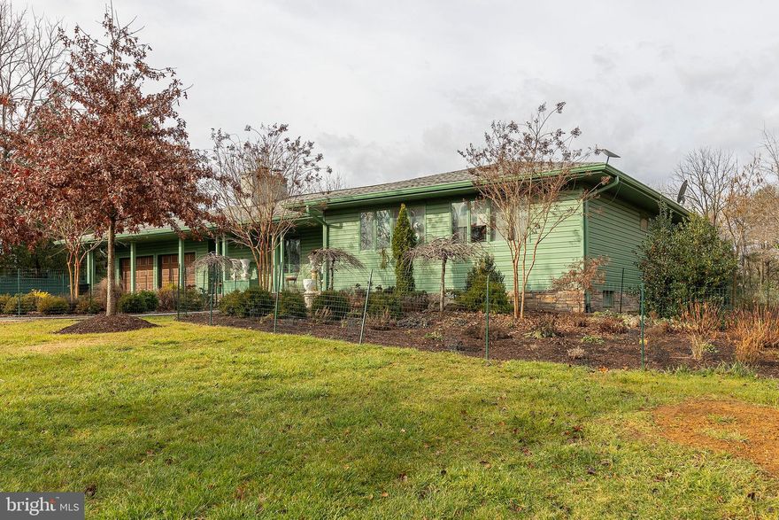 A majestic  90's rancher nestled on 2.47 manicured acres in an established neighborhood.  Abounding in natural light and spacious rooms you will find the comfort of one level living, updated kitchen, family room w/ fireplace and outside porch and extensive rear deck to enjoy your paradise.  Partially finished basement with bedroom and full bath.  This property is being sold AS IS WHERE IS.