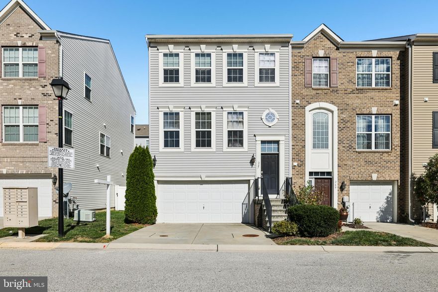 Welcome to 267 Truck Farm Drive, an end-unit townhouse with a two-car garage in the desirable Red Oak Crossing community. This beautifully maintained home offers three bedrooms, three full bathrooms, and one half bath, featuring a bright, open floor plan designed for comfortable living and stylish entertaining.

The main level showcases dark hardwood flooring, high ceilings, and abundant natural light. At the heart of the home is the gourmet kitchen, complete with granite countertops, white cabinetry, a large center island with breakfast bar seating, and stainless-steel appliances. The adjacent family room and direct access to the rear deck create the perfect space for gatherings, everyday meals, or relaxing evenings at home.

Upstairs, the primary bedroom serves as a peaceful retreat with a walk-in closet and private en-suite bath featuring dual vanities, a soaking tub, and separate shower. Two additional bedrooms, a full hall bath, and a convenient upper-level laundry room complete this level.

The finished walk-out lower level offers a large flex space with a full bath and easy access to the backyard, ideal for a recreation room, guest suite, or home office.

Located in Red Oak Crossing, a thoughtfully planned community with green spaces, playgrounds, and walking paths, this home offers exceptional convenience. You’ll be just minutes from shopping and dining options, and within close proximity to Fort Meade, Arundel Mills, BWI Trail, and Patapsco Valley State Park. Commuters will appreciate easy access to Routes 97 and 100, the light rail, MARC stations, and BWI Airport.

Combining modern comfort, location, and community living, 267 Truck Farm Drive is move-in ready and waiting to welcome you home.