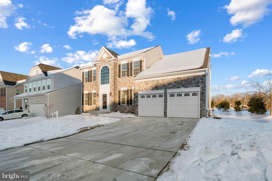Assumable Rate 4.87% plus $10k in closing help. Come and get pre approved at the Open House and move into the house of your choice. This is an expansive home with over 4,000 sq ft of modern living in the sought-after Signature Club community—without the wait for new construction. Situated on a prominent corner lot, the open main level features luxury vinyl plank flooring, a sun-filled layout, and a gourmet kitchen with oversized island, double ovens, Energy Star stainless appliances, walk-in pantry, and farm sink. The living area is anchored by a custom media wall with electric fireplace and 85" TV. Upstairs offers four spacious bedrooms, including a luxurious owner’s suite with sitting area, large walk-in closet, and spa-style bath with soaking tub, dual vanities, and walk-through shower. The finished lower level provides over 900 sq ft of flexible space plus unfinished area with bath rough-in for future expansion. Move-in ready, energy efficient, and minutes to shopping, major routes, and Washington, DC.