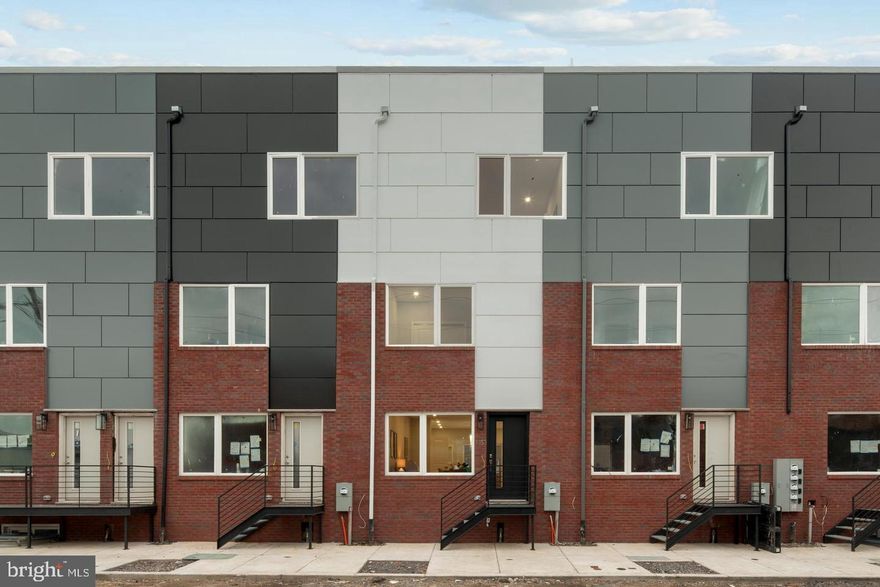 The huge townhome with approx. 2550 sq ft of living space is awaiting for the new tenants. Enter this newly built townhome with 3 beds & 2 1/2 bath into the open concept floor plan which means all rooms on the first floor are open to each other.  Beautiful kitchen with white shaker cabinets, quartz countertop, pantry and huge island on the main floor. Take the stairs up to the second floor and check out the two large bedrooms - one in the rear and one in the front of the home. In between the bedrooms you will see the shared full bathroom and we have placed the full sized laundry room on the second floor hallway for easy access and convenience. Head on up to the third floor where you will find the owner suite complete with large closet system and four piece bathroom (shower stall, dual vanity sinks, soaking tub and toilet) and rounded out with a linen closet for additional storage. Finally, head up to the green roof top deck from the hallway stairs and check out the amazing views of the Philadelphia Skyline. Finally, the full finished basement is sure to be the place to setup your home theater, additional living room space or game room.