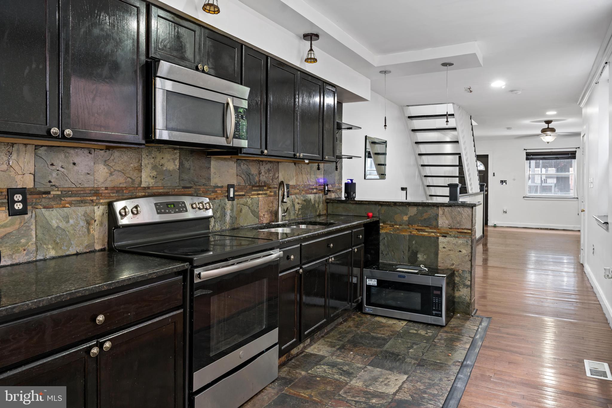 Welcome to 1425 N Front St, a stylish 3-bedroom, 2-bath townhouse in the heart of Fishtown—Philadelphia’s trendiest neighborhood known for its arts, dining, and walkability. This updated home features hardwood floors, a modern kitchen with stainless steel appliances, and a spacious private rooftop deck offering sweeping skyline views. The open-concept layout provides great flow for entertaining, while ample natural light brightens every corner. Located just steps from the Front–Girard SEPTA station, you’ll enjoy quick access to Center City. Stroll to local favorites like LMNO, Suraya, Frankford Hall, and La Colombe, or unwind at nearby parks including Palmer Park and Penn Treaty Park. This is the ideal blend of comfort, style, and unbeatable location.
