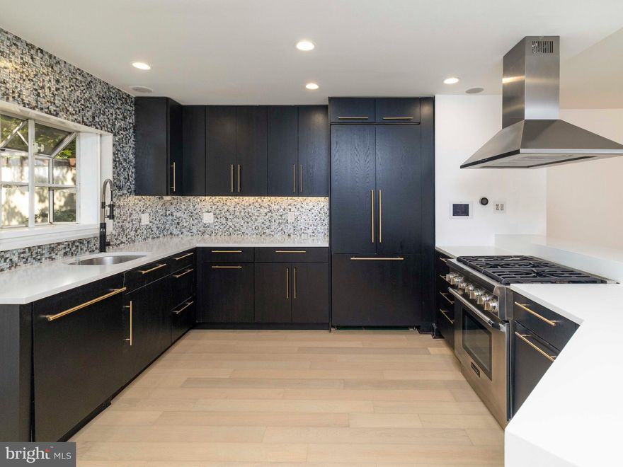 Beautifully updated, ultra-wide 3-bedroom, 3-bathroom residence tucked into the heart of historic Society Hill. This thoughtfully designed home offers refined finishes, smart technology, and private outdoor space—all in one of Center City's most sought-after neighborhoods.

Enter into a spacious entryway with ample storage, including a large custom-designed closet. The first-floor bedroom features an en-suite bath and oversized closet with built-ins—perfect for guests or an ideal home office setup.

Upstairs, the main level stuns with floor-to-ceiling windows, brand-new hardwood flooring, and an open layout that blends function and style. The sleek kitchen is outfitted with a high-end Thermador appliance package, pantry storage, and a seamless flow to your tranquil backyard oasis complete with built-in planters and mature trees. The living area includes a Juliet balcony, steam-powered fireplace for ambient warmth, and integrated speaker system—all managed through a full smart home setup.

On the third level, the expansive primary suite offers a serene retreat with a spa-like bath featuring double vanities, a freestanding tub, and a luxurious his-and-her walk-in shower. A large walk-in closet and a conveniently located laundry room complete this floor.

The top level features a second primary suite with its own walk-in closet and direct access to a private roof deck.

All of this in a prime Society Hill location, steps from restaurants, parks, and everything Center City has to offer.

Schedule your private tour today