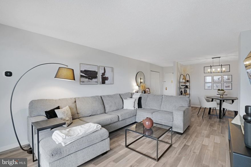 Welcome home to The Greenhouse! All utilities and in-unit laundry are included in this updated 2 bedroom condo! Sleek luxury plank floors lead you into the spacious living room, where you’ll discover floor-to-ceiling windows flooding the space with natural light. It opens directly into the dining room, making the space ideal for entertaining friends and family. Continue into the renovated kitchen and you’ll find bright Shaker-style cabinets, stainless steel appliances, and a large pantry. Down the hall, the expansive bedroom features a walk-in closet with custom built-in storage and a gorgeously refreshed en suite bathroom. Off of the living room, the second bedroom is tucked away with a picturesque view and wide closet. In the hall, you’ll find a half bathroom with cabinet storage and modern fixtures, plus convenient in-unit laundry and ample storage. Step outside onto your private balcony and enjoy the peaceful panoramic view while you sip your morning coffee or unwind after a long day. This secure building offers 24/7 concierge service and security cameras throughout the property. No worries about parking in this community, with a reserved space in the secure garage, ample visitor parking, and free unrestricted street parking available. Additional amenities are plentiful and include an outdoor pool, tennis courts, community garden, grilling and picnic areas, a car wash station, and recycling room. Conveniently located just minutes to Harris Teeter, Giant Food, CVS, Shoppes at Foxchase, Alexandria Commons, Holmes Run Park and Trail, Old Town Alexandria, Kingstowne Towne Center, Mark Center, INOVA Alexandria Hospital, and The Pentagon. The location is a commuter’s dream, with DASH and Metrobus stops both at the front entrance. Quick access to Van Dorn Metro Station, Duke Street, Van Dorn Street, I-395, I-95. Schedule a private tour of your new home today and make 2026 the best year yet!