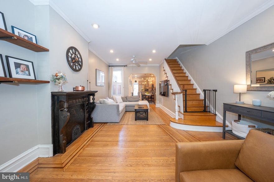 Welcome to 883 N Pennock Street!- A very charming, fully renovated 3 bedroom/1.5 bath Art Museum Area home rich with character & timeless architectural details. Situated on a picturesque block just minutes to Kelly Drive, Boathouse Row, Fairmount Park and the major highways, this location offers both tranquility and convenience. This exceptional home boasts picture-perfect curb appeal and a large, private beautiful garden- ideal for relaxing or entertaining outdoors. Step inside to a vestibule entry that opens to a spacious, light-filled living room featuring the original oak floors w/walnut inlay, high ceilings, a decorative mantel, crown moldings and stylish built-in shelving. A separate dining room provides the perfect setting for gatherings and entertaining. The renovated open kitchen is equipped with granite countertops, Wi-Fi enabled stainless steel appliances and impressive cabinetry. A convenient laundry area & powder room complete the main level. The second floor offers a rear bedroom, accessed through a dramatic arched doorway, which is highlighted by a large bay window that fills the space with natural light. This level also includes an oversized, renovated full bathroom, a good-sized middle bedroom with California Closets, and a spacious primary bedroom featuring the original beautiful armoire.  The basement provides excellent storage space, adding to the home's functionality. Additional special features include: a Wi-Fi thermostat, keyless entry & doorbell camera. With its blend of historic charm, thoughtful updates, and an unbeatable location, this home is truly a special find.