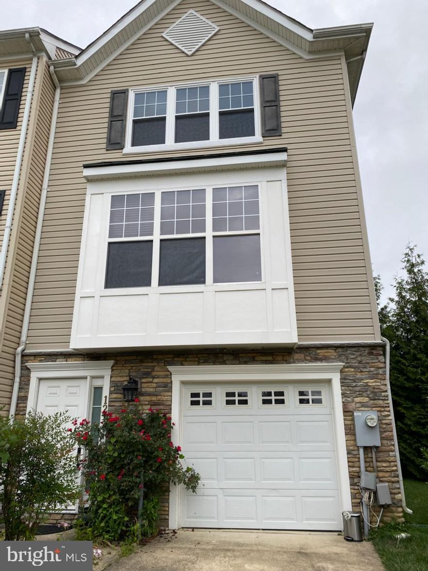 Gorgeous end unit Garage  townhome just a mile from Rockville Town Center & Metro. 3 
finished levels, with 3 Bedrooms and 3 full Baths. Hardwood floors  on main level, Kitchen with granite counter and stainless steel appliances, Breakfast area ,Living room w/ Gas fireplace and Dining room. Walk out to rear Deck. Entrance level  has Large Bedroom and a full bath with walk- in closet, exits to backyard patio. Upper level features Master  suite with walk -in closet  and master bath with Dual Vanity . An additional 3rd Bedroom and full bath. 
Move in Sept.1st.Shows Well !!