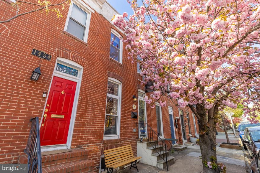 Located on one of the most charming blocks in Riverside, 1452 Battery Avenue is
warm, welcoming, and full of character. This sweet and thoughtfully renovated rowhome
offers 2 bedrooms, 2 full bathrooms, a spacious back patio, and is perfectly located right
on the border of Federal Hill and Riverside, giving you the best of both neighborhoods.

Step inside to a warm, inviting living space filled with natural light, where the layout
flows from the cozy living room into an updated kitchen with stainless steel appliances,
open shelving, and just the right amount of charm. It’s the kind of home that feels easy
from the moment you walk in... perfectly move-in ready, whether you’re looking for your
first home or a low-maintenance city retreat. 

Out back, you’ll find a generously sized patio with plenty of space for lounging and entertaining... an unexpected bonus and the perfect extension of your living space. Upstairs, you'll find one of the bedrooms, a convenient laundry stack in the hallway, and a very spacious full bathroom with marble tiles and a large walk-in shower, complete with a built-in bench that we all love... so luxurious! 

The lower level adds flexibility, with a second bedroom featuring a custom Murphy bed that can be tucked away, opening up the space for a home office, gym, or additional living area. How convenient?! A second full bathroom and extra storage complete this level.  

Set on a picturesque street lined with string lights, this home captures the best of city living with a neighborhood feel. Just moments from Riverside Park, Federal Hill Park, Cross Street Market, and countless coffee shops and restaurants, you’re right in the heart of it all while still enjoying a quiet, tucked-away block. 

A truly special move-in ready home in one of Baltimore’s most loved neighborhoods.
