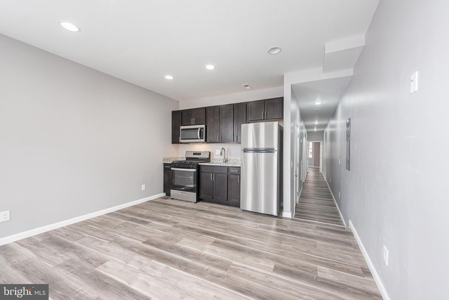 SPACIOUS NEWLY RENOVATED 2 BEDROOM APARTMENT LOCATED IN A CONVENIENT LOCATION!  This unit is approximately 915 sq. ft. and features new laminate wood flooring throughout, a spacious living room, updated kitchen with new ss appliances & granite counters, 2 large bedrooms, 1 full bath, and in unit laundry!  MINIMUM CREDIT SCORE OF 620 REQUIRED TO BE CONSIDERED!