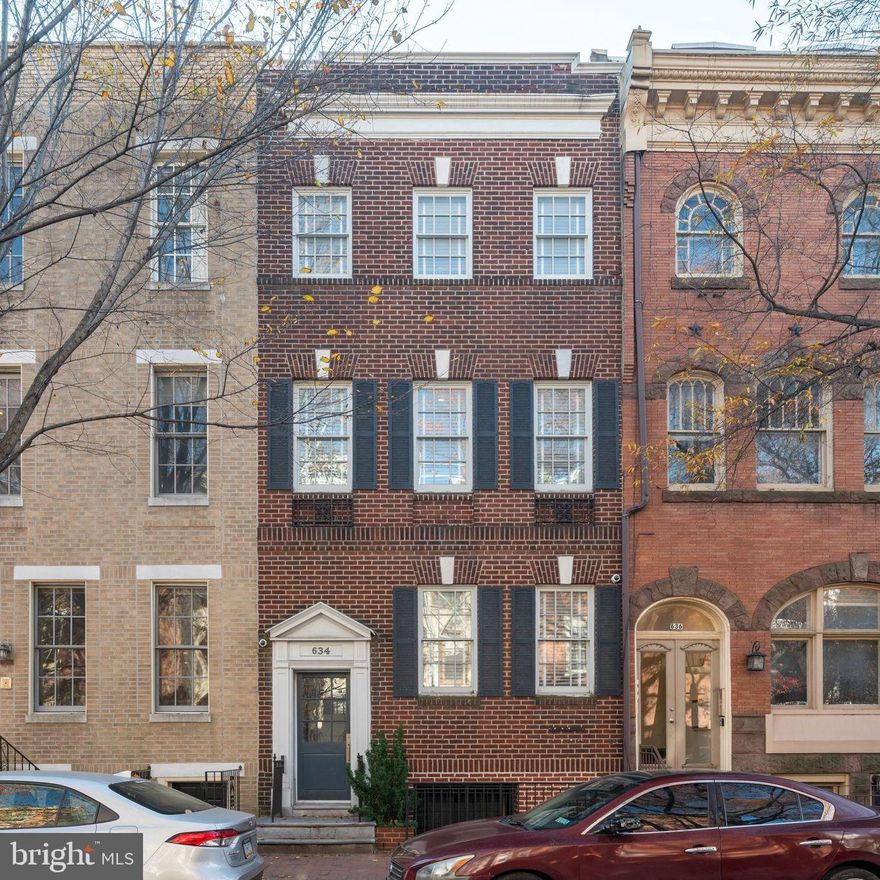 Top to bottom, Fully remodeled in 2017, 5 Bedroom/ 5 full+2 half Bath home in historic and sought-after Society Hill. 141 feet back to front, this street to street double lot allows for you to have a private, detached, covered 2-car garage with remote operated door. Garage has second level for extra storage space and is equipped with plumbing, electric and ethernet capabilities with income potential if you desired to build out an apartment. Between the home and garage is a 2-tiered outdoor courtyard with 2 gas lines for grill and heater and bordered by two custom brick walls. 5,200+ sqft of finished living space, this meticulously thought out floor plan has kitchen, powder room and 2 living spaces on the main level, owner's suite, laundry room and second bedroom with en-suite bathroom on 2nd floor, and 3 bedrooms and bathrooms on 3rd floor (1 currently used as a gym). There is also a fully finished basement with large living area, half bath, home theater set up, 2 walk out doors and is fully french drained with sump pump. This home has a chef's kitchen equipped with plenty of storage space inside the solid wood cabinets, has beautiful quartz counters with sink  with Grohe faucet, and hand painted tile backsplash, and a 9+ foot island with quartz countertop and second sink with Grohe faucet. The kitchen boasts stainless steel appliances that include a Wolf double oven, Wolf gas range and hood, Miele dishwasher with auto opening to dry, built in drawer microwave, and Sub-zero french door fridge. Upstairs, the primary suite has Chamfered ceilings, a spacious walk-in closet with island dresser, and the primary bath is fully marbled with 2 sinks with Brizo faucets, makeup counter, private toilet room and steam shower with shower guard glass.  Main features of the home include 3/4" solid quarter and rift white oak floors, 7' ,1-3/4" solid doors throughout with Emtek hardware, custom finished closets and Carrera marble walled bathrooms. Additional upgraded features include, integrated Sonos controlled speakers throughout home, Rukus Wi-Fi waps with a mesh network so there is no loss of signal, and full burglar and monitored smoke alarms. Utilities are high efficiency with many perks. There are 4 zones of HVAC, 1 per floor, all connectable and controlled through Honeywell app, a hot water loop for faster hot water throughout the home and cast iron drains and copper pipes. With easy roof access from the house, the TPO roof is highly durable, low maintenance and energy efficient. You will be hard pressed to find a better home with all the creature comforts and amenities that 634 Pine Street has to offer. Don't miss out and set up a showing today!