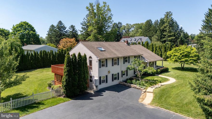 Welcome to 1434 Sugartown Road, a fantastic opportunity to own a solidly-built FIVE-bedroom, FOUR FULL bathroom home set on a level lot in the heart of the top-ranked Tredyffrin-Easttown School District. This sprawling residence offers exceptional living spaces both inside and out, along with an incredibly deep oversized two++ -car garage. The main level features an open-concept living and dining area with sliding glass doors leading to the recently painted rear deck. The heart of the home is the fabulous kitchen, complete with high-end cabinetry, stainless steel appliances,  granite countertops, nice tile backsplashes and a granite breakfast bar that opens seamlessly to the dining area and outdoor entertaining spaces. The expansive deck overlooks the meticulously maintained rear grounds and serves as the perfect setting for relaxing, grilling, outdoor dining, and entertaining. The second floor is home to an incredible owner’s suite featuring a walk-in closet with custom shelving and storage space, a vaulted ceiling, two skylights, a gas fireplace and private deck access overlooking the rear yard. A beautifully appointed owner’s bath offers a seamless glass shower surround and jetted soaking tub. The suite is remarkably spacious and offers tremendous flexibility for a sitting area, home office, or additional lounge space. This room truly must be seen to be appreciated. Two nicely sized additional bedrooms are serviced by a tiled hall bath. The upper level is home to a private fourth bedroom or home office with its own ensuite bathroom, creating an ideal guest suite or quiet workspace. The lower level features a beautifully tiled family room with a kitchenette and a doorway to the rear yard. A flexible fifth bedroom is serviced by a full bathroom. This level is home to an additional bonus room offering endless possibilities such as a gaming room, playroom, home gym, business center, homework area, or media space. The outdoor area is truly special. Mature landscaping and thoughtfully planted greenery create a tremendous sense of privacy throughout the rear level yard. For years the owner maintained a nice vegetable garden off the garage. Depending on vehicle size, the massive garage can accommodate anywhere from two to four cars. Hardwood floors, quality tile work, recessed lighting, ceiling fans, tremendous closet and  storage space, four finished living levels, and an exceptionally flexible floor plan all come together to create a very special place to call home. Ideally located in the heart of Berwyn, close to the trains, shops, and restaurants of the Main Line, and within the highly sought-after Tredyffrin-Easttown School District, this is the one you have been hoping would come onto the market. Welcome home!