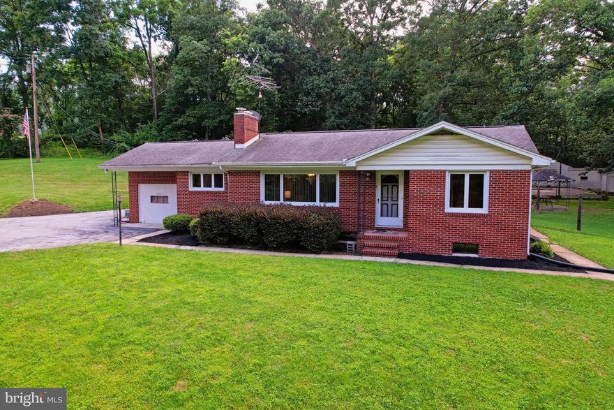 ROCK BOTTOM PRICE!!!  Where Country Comfort Meets Endless Possibilities — Your 5-Acre Retreat Awaits.
 Imagine waking up each morning to the soft rustle of trees and the gentle hum of nature just beyond your window. The sun filters through the curtains as you make your way across warm wood floors to the kitchen, where the coffee brews.  Welcome home to your own peaceful retreat—where the pace is slower, the air is fresher, and life feels a little more grounded.

This solid brick rancher sits proudly on 5 beautiful acres, offering a sense of space and freedom that’s hard to find. With 3 bedrooms and 1.5 baths, there’s room to grow, gather, and simply enjoy. In the heart of the home, the living room invites you to relax beside the striking stone fireplace, while the separate dining room is ready for home-cooked meals and holiday memories. The eat-in kitchen offers a casual spot to chat over breakfast, and the enclosed rear porch becomes your favorite place to sip sweet tea and watch the seasons change.

Downstairs, the lower-level family room with a wood-burning stove sets the perfect scene for cozy movie nights or Sunday afternoons with a good book. Outside, the detached 2-car garage with a workshop and additional machine shed gives you space to tinker, build, or store your toys and tools.

This property isn’t just a home—it’s a lifestyle. There’s room for gardens, nature walks, and evening bonfires under the stars. Whether you're raising a family, downsizing with purpose, or dreaming of a hobby farm or peaceful weekend getaway, this home gives you the space and the setting to live your vision.

With radiant ceiling heat, central air, all appliances conveying, and a long driveway with ample off-street parking, this home offers both comfort and convenience. Come experience what it feels like to finally breathe, stretch out, and call the country home. Your story starts here.  Call today to schedule a tour of this home!