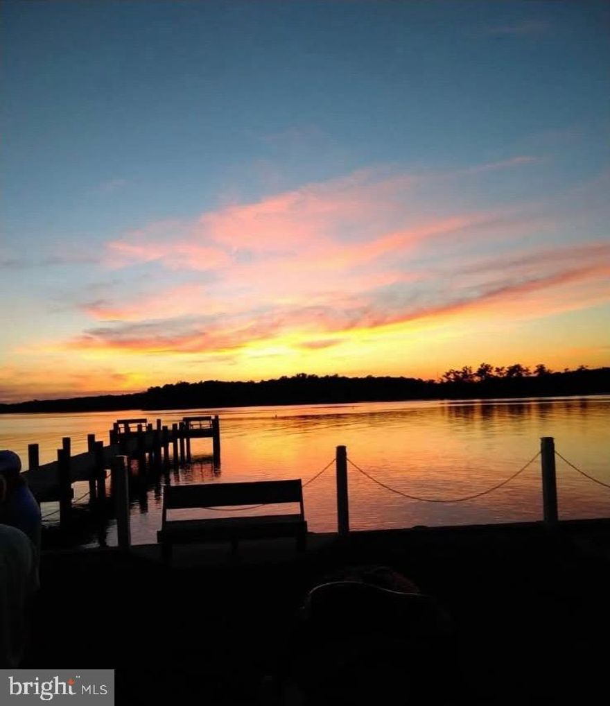 Welcome to 6801 Harewood Park Dr, Middle River. This brick rancher sits on a generous corner lot and offers a comfortable 2 bed, 1 bath layout. A standout 30' x 50' garage with tall doors suits car enthusiasts or hobbyists. Water views, plus access to a vibrant community with a center, boat ramps, and other amenities—create your ideal home or smart investment. Sold as-is