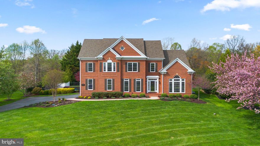 Welcome to this meticulously maintained Wellington West gem backing to forest conservation and fronting to hard-to-find pastoral views. Endless upgrades include: new roof (2017), spa-inspired primary bath (2020), heated in-ground saltwater pool (2020), water treatment system with UV light and tankless hot water heater (2020), 3-zone upper level HVAC (2023), main level 5-stage HVAC (2024), new siding and house wrap (2024), new gutters (2024), and an insulated garage door with side-mounted motor (2024). Brazilian cherry hardwood floors flow through the main and upper levels, soaring vaulted ceilings, and countless oversized windows flood the space in natural light. Crown moldings, wainscoting, and custom closets throughout elevate every detail. The main level boasts a private office and a formal living room with cathedral ceilings, offering stunning views of a neighboring horse farm. An expansive butler’s pantry connects the formal dining room to a gourmet kitchen, which opens to a two-story family room anchored by a custom stone wood-burning fireplace (2020). Take either stairway upstairs where the primary suite awaits, featuring a tray ceiling, abundant windows, and a newly remodeled spa-inspired bath (2020) with a soaking tub, oversized frameless shower, and double vanity with plenty of storage. Three spacious bedrooms and two full baths complete the upper level. The walk-out lower level unveils a vast rec room with a wet bar, gas fireplace, and full bath, flowing out to a custom patio and a stunning in-ground heated saltwater pool. Renovated in 2020 the pool sparkles with pebbletec glass plaster, travertine coping, LED lights, and an energy efficient heat pump to extend your swim season. Landscaping professionally re-designed in 2021. Smart features abound: Nest cameras, Nest smoke alarms, Phillips Hue outdoor lighting, a Tesla charger, and custom lighting upgrades throughout. Set in Howard County's top-rated school district and convenient to outdoor escapes like Cattail Creek Country Club, and Western Regional Park nearby.