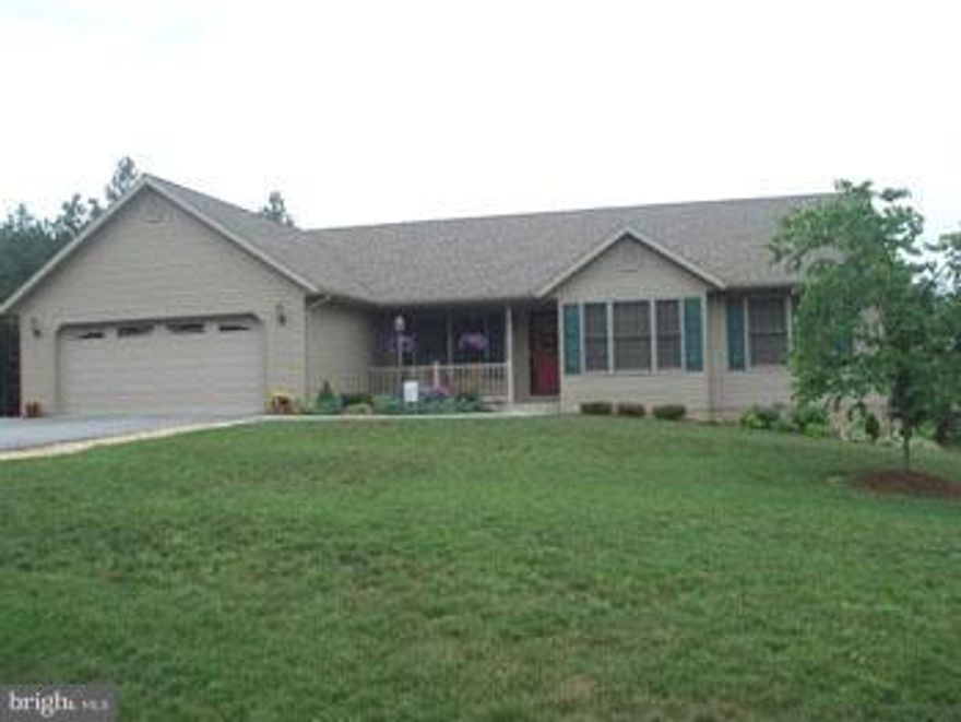 QUALITY BUILT IN - 2000 sq. ft. 4BR, 2.5 BA Rancher situated on 1.18 Acres just minutes from Berkeley Springs and I-70. One level living w/ open kitchen, dining and LR floor plan.  Features wood floors, ceramic tile, solid wood doors, granite counter top, gas FP.  Front Porch and Spacious back deck overlooking Pond. 2 car garage + 1 car in bsmt.