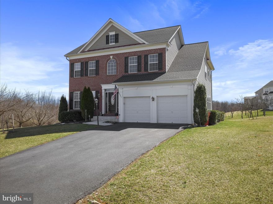 This magnificent Shepherdstown home in Prestigious Deerfield Village offers well over 4000 Square Feet and includes  6 bedroom and 4.5 bathroom.  Owners took the feedback from the previous listing and enhanced this property even more.  The home is move in ready with nothing needed to make it your own. You feel the pride in ownership with the opening of the custom front door into the curved stairs and soaring ceilings of the foyer.  The awe inspiring custom molding and millwork is featured throughout the home with 5 piece crown molding and shadowboxing, heavy base, and other incredibly thought out trim features.  Backing to the old orchards of Shepherdstown, the views of the common space and community walking path give you a feeling of space and peace without the duties of maintenance.  Every window on the main floor has custom installed plantation shutters , providing a look and feel of privacy and custom treatments.  The home has been custom painted throughout and features upgraded lighting fixtures at every opportunity.  The bamboo hardwood offers strength and durability throughout the main level. The Kitchen features two-toned custom cabinetry, complete with glass panel cabinets in just the perfect places, as well as light rail, under cabinet lighting and custom wine rack.  Granite countertop flows throughout the kitchen and provides a two level kitchen island, the perfect place to entertain guests, while plenty of counter space provides meal preparation.  The butler/prep bar adds yet more countertop and prep space to this tremendous space.  The family room has a gas marble fireplace with custom molding around and above. Off the family room is the home office with French doors.  The bamboo continues up the stairs and leads to 5 Large Bedrooms.  The Primary bedroom features vaulted ceilings and dramatic beams and plantation shutters. Step up a couple stairs into the closet and master bath area where you will find double walk-ins, huge shower, soaking tub, and dual separate vanities.  There are 4 additional bedrooms on the 3rd floor and 2 full bathrooms.  The main bath was recently renovated as well.  There is a convenient linen closet and laundry room with utility tub, washer and dryer and cabinets for storage.  The finished basement features a large recreation space, bar, exercise area, and 6th Bedroom with full dual entry bath.  

Recently installed patio off the back showcases the Nature Trail for outdoor enthusiasts, runners, and bikers.  Located just 2 miles from downtown Shepherdstown, Shepherd University, Dining options, and an All American Downtown Atmosphere makes this a perfect choice.  You are also just minutes from Charles Town or Martinsburg or larger scale shopping and dining opportunities.   Recent Upgrades over last five years Include:
New carpet throughout 2nd floor bedrooms (2025)
New basement LVP flooring (2024)
New complete HVAC system all zones (2024)
Washer/dryer (2023) 
New roof with Arch Shingles (2023)
Kitchen appliances (4 burner gas cooktop with downdraft 2020, microwave 2020)
Water heater (2020) 
Updated 3rd floor princess suite bathroom (2020)