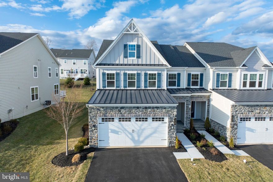 This pristine, never-lived-in home is a stunning Haverford floorplan model, nestled in the prestigious Greystone community and ready for you to make it your own! As you step inside, you'll be welcomed by abundant natural light and a striking oak wood staircase with white pine risers. The spacious foyer leads to a private office, complete with French doors and wiring for a flat-screen TV—a perfect setup for a home office, cozy living area, or library. The heart of the home is the breathtaking open-concept living and kitchen area, ideal for entertaining. The oversized island with quartz countertops is perfect for meal prep or casual dining, complemented by elegant pendant lights, under-cabinet lighting, and abundant recessed lighting. The kitchen is equipped with a five-burner gas cooktop, a large, vented hood, a tiled backsplash, and a walk-in pantry, making it a dream space for any aspiring chef. Comfort is ensured with a dual-zoned, smart thermostat-controlled HVAC system. The mudroom is a convenient addition, offering organized storage for coats, jackets, and backpacks, along with a spacious storage closet and a powder room. The low-maintenance composite deck is great for outdoor enthusiasts and perfect for barbecues, summer parties, or simply unwinding with a cup of coffee. On the second floor, you’ll find four generously sized bedrooms. The luxurious primary suite is a private retreat featuring a tray ceiling, two large walk-in closets, a double vanity, a spacious shower, and a separate toilet area. The three additional bedrooms boast large walk-in closets and share a hall bathroom with dual vanities and a tub/shower combination. A versatile loft area provides extra living space. The finished lower level adds even more flexibility, offering space for a playroom, game room, gym, or additional family room, complete with a full bathroom for convenience. The two-car garage includes automatic door openers and a keypad for easy access. The Greystone community is ideally located just minutes from West Chester Borough, shopping and dining in Exton, the train station, and the township park. Outdoor enthusiasts will love the miles of walking trails in the beautiful Greystone Preserve.