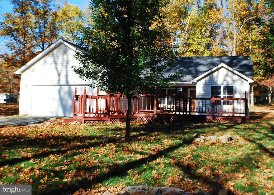 "Country Living ",Enjoy the wild life from your front and rear decks at this well cared for Rancher which is sitting on almost 6  wooded private acres. Huge  living room w/fireplace to warm your body on the cool day's just around the corner. Master bedroom with full luxury bath. Home has lots of storage areas. Approx.. 4 miles off Rt.50. making an easy commute .Home Warranty with an accept offer.