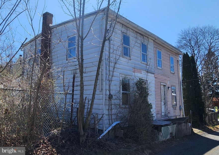 This double home needs to be completely refurbished. You can put everything NEW into this double home or convert it to one larger single. Cash sale only and buyer must remove remaining items from home.