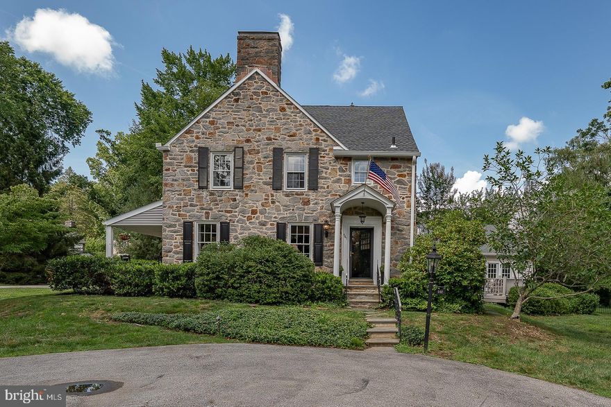 Nestled in one of the most desirable neighborhoods in Wayne, this classic four-bedroom stone colonial offers timeless appeal and a walk-to-everything lifestyle. Strolling distance to shops, restaurants, and the train, and located within the award-winning Tredyffrin-Easttown School District, this home blends traditional character with modern updates, a large flat almost half acre lot.  The possibilities are endless!  
A gracious entry foyer welcomes you with rich hardwood floors and classic moldings. The elegant living room features a wood burning fireplace, deep windowsills, and a door leading to a charming covered porch—perfect for seamless entertaining or relaxation. The formal dining room is bright and spacious, anchored by a large picture window overlooking the side yard.
The updated eat-in kitchen boasts abundant cabinetry, generous counter space, a brand new range, a large sink with stylish new faucet, and a sunny view of the backyard. A side entrance opens to a secondary foyer, leading to a large mudroom, a full bathroom, and a convenient laundry room with new washer and dryer.
The heart of the home is the expansive family room addition, offering a soaring ceiling, a second fireplace, and French doors to the deck overlooking the side yard with small koi pond. A unique vaulted loft space above the family room provides a sunny and inspiring home office or reading retreat.
Upstairs, you’ll find four spacious bedrooms, including a serene primary suite with an en suite bathroom. A well-appointed hall bathroom serves the additional bedrooms. Stairs lead to a large attic offering excellent storage and a cedar closet.
The finished lower level provides additional living space, ideal for a playroom, second family room, or home gym.
This exceptional property offers comfort, convenience, and character in a prime Main Line location. Don’t miss your chance to call it home.