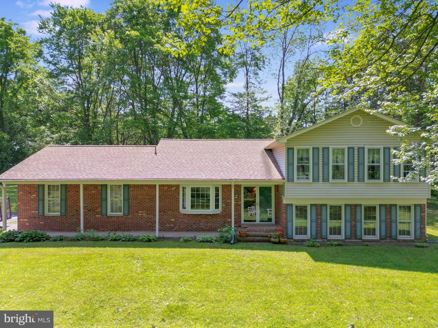 Welcome home to this charming, well maintained single family home situated on over 2 acres in Nokesville. This home offers privacy as well as the convenience of being located near shops, restaurants and much more. As you enter the home it is filled with natural light throughout. The kitchen has been remodeled to include stainless appliances and granite counters. With ample cabinets and a spacious pantry, the storage in this kitchen is incredible. The dining room and living room are both located on the main level and lead outside the double doors to your backyard. Relax outside on the deck and enjoy the tranquility of your private lot surrounded by trees. Back inside the home upstairs boasts 4 bedrooms and 2 full baths. The basement is a perfect place for you to sit and gather with friends and family- the fireplace is surrounded by a brick wall making it a focal point of the room. The basement also has a powder room, laundry room and an additional bonus area. It can be used for storage, an office, or den, the possibilities are endless. Outside the shed is large enough to store all of your yard equipment and tools- you can also use it as a workshop. This home has everything you have been looking for and it's one you won't want to miss!!