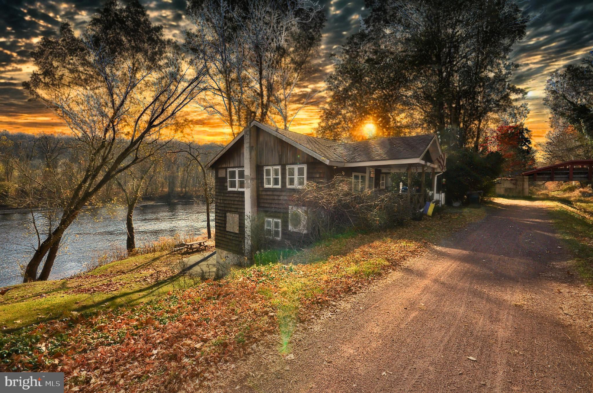 Secluded Riverfront Retreat with Unmatched Views in Pipersville • Now Listed at $599,000!
Welcome to 14 Bridge Five Lane, a rare opportunity to own a beautifully updated riverfront home with 50 feet of Delaware River frontage and riparian rights, directly across from Treasure Island. Tucked away on a secluded lane with exclusive access, this charming 2-bedroom, 1.5-bath bungalow offers both serenity and connection to nature, making it the perfect primary residence, weekend escape, or future rental investment.
Step inside to discover a light-filled living space with luxury vinyl flooring, updated windows and doors, and thoughtfully renovated bathrooms featuring modern fixtures and finishes. The open-concept layout includes a bright kitchen with newer appliances and a cozy living area ideal for entertaining or relaxing after a day on the river.
Enjoy peace of mind with split-system HVAC, a full-house generator, and recent system upgrades. Outside, unwind in the backyard with panoramic water views, perfect for kayaking, fishing, or soaking in the tranquility of nature.
Located alongside the 75-mile towpath, this home offers easy access to hiking, biking, and endless outdoor recreation. Just a short drive from New Hope, Frenchtown, and Doylestown, yet worlds away from the everyday hustle.
📍 Key Features:
• 2 Bedrooms | 1.5 Bathrooms
• 1,296 sq ft | 0.10 Acres
• Waterfront with riparian rights
• Newer systems, appliances & finishes
• Secluded setting with exclusive access
• No HOA | Low Taxes | Palisades SD
• Ideal for full-time living, weekend getaway, or rental potential
Don't miss your chance to own this slice of riverfront paradise. Schedule your private showing today!