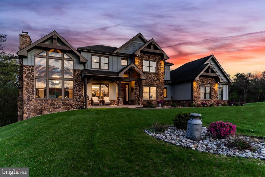 Stunning, rustic contemporary home with a perfect blend of character, security, and modern efficiency, set against picturesque mountain views in the heart of the Fishing Creek Valley. This beautifully updated, move-in ready Roland-built home offers a warm yet refined retreat designed for both everyday living and exceptional entertaining.  Conveniently located to Harrisburg, Hershey, HBG Country Club, Major Transportation and Shopping.

At the center of the home is a showpiece kitchen featuring a brand new Michelangelo quartzite island, freshly painted cabinetry, new backsplash, new icemaker, and newer appliances. Large windows surround the space, including a farmhouse sink overlooking the backyard, filling the home with natural light and framing scenic views. Expansive cathedral ceilings enhance the open feel while capturing the beauty of the surrounding blue mountains. 

Recent improvements include full interior and exterior repainting, all new designer light fixtures and chandeliers, new tile flooring in the office, and new carpet in the primary suite and four additional upstairs bedrooms. The main level also features a new guest bathroom vanity and fresh paint, creating a clean, updated feel throughout. Additional highlights include hardwood flooring, a desirable open floor plan, a functional mudroom, and push-button blackout shades in the primary bedroom and bath, along with blackout shades in all upstairs bedrooms.

Designed as a true smart home, the property offers seamless control of multi-room audio, smart lighting, security, and cameras from a single easy-to-use interface accessible from any device. Enjoy premium speaker systems on the main and lower levels, 24/7 security with on-site recording and professional monitoring, and smart lighting with automatic and security-triggered activation.

The fully finished lower level is an entertainer’s dream, featuring a spacious retreat, a new full bathroom with coffered/copper ceiling, a custom walk in gun safe room, and a hidden Murphy door leading to a newly built storage area. A thoughtfully designed bar area with sink and brand new mini refrigerator creates the perfect setup for hosting guests or enjoying a private lounge space.  Don't miss the heated flooring in the basement!

Set on 25 private acres, this property offers unmatched seclusion, natural beauty, and abundant wildlife, including deer, turkey, and bear, making it a rare opportunity for outdoor enthusiasts. A creek winds through the property, enhancing the peaceful setting. Outdoor improvements include a freshly painted storage barn, newly painted bridge, a new driveway lined with Royal Burgundy cherry trees, and beautifully rocked front yard landscaping.

Additional highlights include a 3-car garage with new Fox-coated flooring, an upstairs deck, and a covered lower-level patio.

This home delivers a rare blend of lodge-inspired character and modern sophistication, all in a setting that feels like your own private mountain retreat.  This home is for the most discerning buyers.