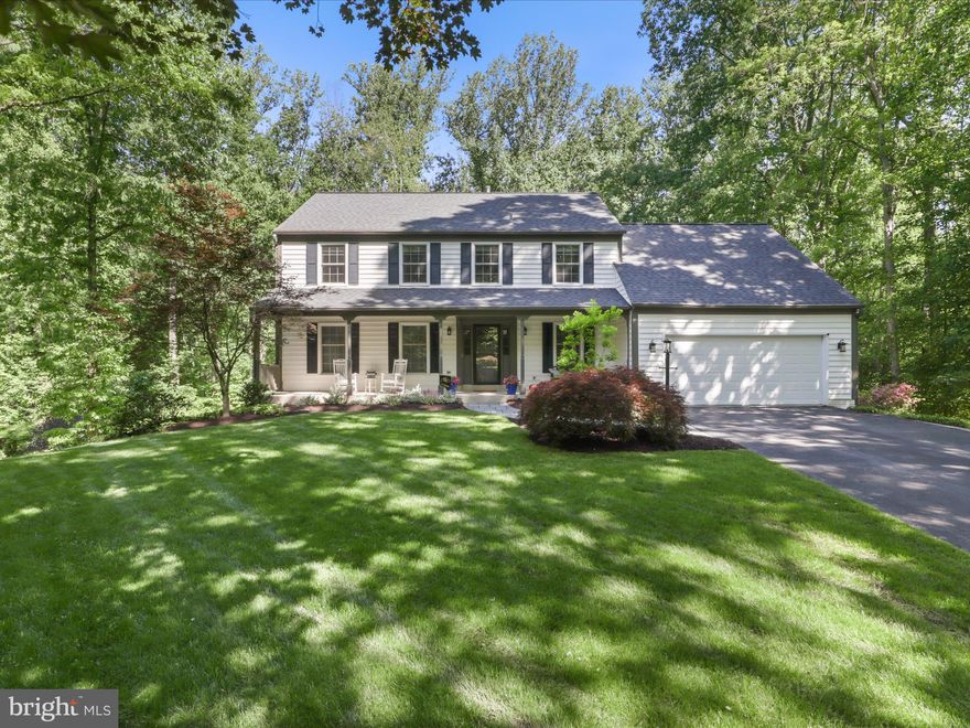 Welcome home! This stunning and spacious colonial with great curb appeal is located in the highly sought after and picturesque community of South Run. With over just under 4,000 square feet of well-designed living space on .64 acre private FULLY FENCED FLAT lot, this 5 bedroom, 3 full plus a half bath home is a real gem with a floor plan for impressive formal entertaining and easy everyday living! This home has GORGEOUS upgrades. From the peaceful porch step inside the welcoming foyer to the formal office/library,  inviting and open living room and IMPRESSIVE gourmet kitchen! The kitchen is the heart of the home and this one does not disappoint. Filled with cabinet and counter space galore, it is centered around a beautiful soapstone island with seating for four and features two-toned soft close Fabuwood cabinets, custom pullouts, commercial grade Jenn Air stainless-steel appliances (six burner range w/hood vent, convection microwave, one electric oven and one gas, large capacity wine fridge and more!), a farm sink, full pantry and the list goes on! From the kitchen, you’ll enjoy dining space that opens to a peaceful screened in porch overlooking trees and a creek (and no direct rear neighbor)! The family room has built in’s surrounding a gas fireplace.  Upstairs, which is newly carpeted, you’ll find FIVE bedrooms, upper level laundry and plenty of storage. The primary suite has three closets and two split vanities making getting ready in the morning easy. The traditional flow of this home is spacious and well-designed, punctuated by beautiful new wide-plank hardwood look LVP floors throughout the main level and custom moldings. On the lower level you’ll find a finished walkout basement with a recreation room/gym that opens to a lower patio with new built-in fire pit and flat yard, updated full bath, and a workshop/unfinished storage space (with additional attic and gated space under the screened-in porch for more storage). Plus, a wide two-car EPOXIED garage with storage racks and a paved driveway for extra parking. As if that's not enough, it comes equipped with your very own home generator! Very fancy. You will love the bright, cheerful rooms and the abundance of windows that allow natural light and seasonal enjoyment any time of year! It checks all the boxes for a forever home! South Run is a well-established neighborhood with a swimming pool around the corner and an award-winning swim team, tennis & basketball courts, tot lot, rec field, pond and a variety of community groups and events! Enjoy easy access to Burke Lake Park with a trail at the end of the cul-de-sac. Plus, with miles of association and county trails that are intertwined throughout the community, residents are within just a few miles of beauty and recreational offerings. Burke Lake Park, Fountainhead Regional Park, and two public golf courses - Burke Lake & Laurel Hills are nearby. Blue Ribbon Winner Sangster Elementary and Lake Braddock Secondary school make this home very desirable. The peaceful charm of the Historic Town of Occoquan, the Occoquan Reservoir and the beauty of the Virginia countryside are all just also short drive away. The South Run community enjoys convenience to commuter corridors of I-95, Route 66, Route 123, and the Fairfax County Parkway; and public transportation including commuter lots with access to the Pentagon Express Bus, METRO, VRE, etc. Fairfax Station is a FANTASTIC place to live, with highly rated schools, easy access to modern amenities, lots of green spaces and quiet suburban living! Carpet (2025), Paint (2025), Kitchen (2022), Floors (2022), LL French Doors (2022), Slate Patio + Firepit (2022), Roof (2017), Windows (2017), HVAC (2012), Hot Water Heater (2014),  Briggs and Stratton Generator (Newer).