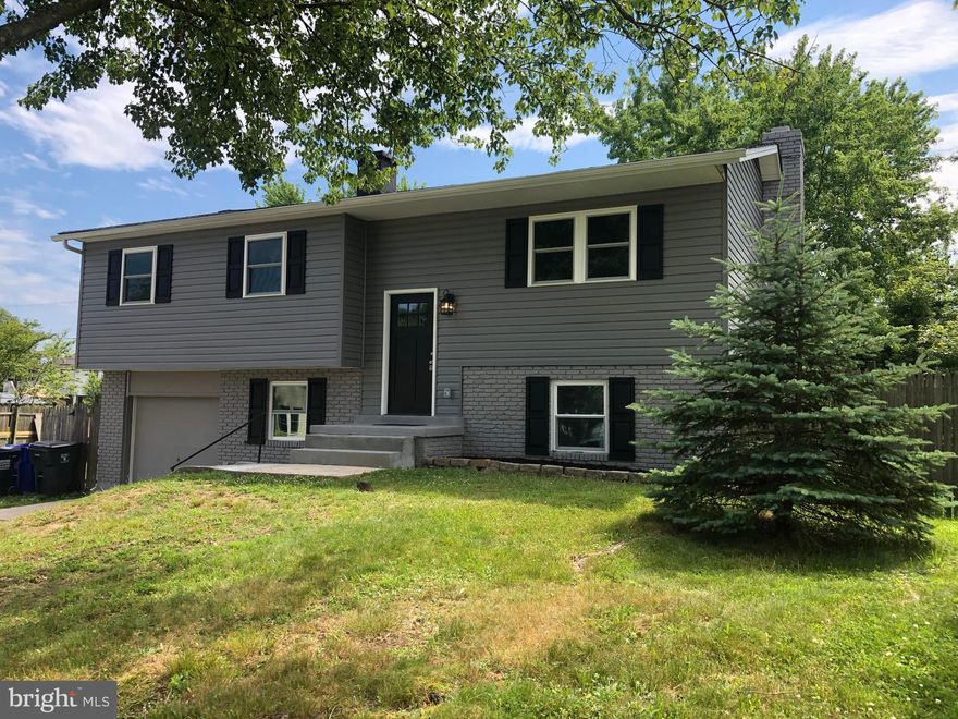 Don't miss this COMPLETELY RENOVATED 3-bedroom (with a possible 4th in the lower level) SFH. No detail missed in this gorgeous renovation complete with all new plumbing, electrical, HVAC, and SS appliances to include gas cooking and select lighting fixtures.Upscale granite countertops, high-end bathroom tiling, and recessed lighting throughout make this home move-in ready! Tastefully done exterior with modern gray brick and  siding, to include an attached 1-car garage.  Lush green grass complete the yard, making this gem perfect for entertaining.Welcome home!