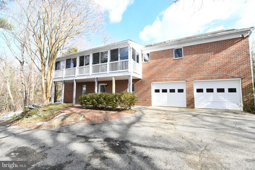 Welcome home! This recently renovated 5 bedroom 3 bath home is perched atop a 1.12 acre hill in White Sands near Vera's Beach Club and Marina and boasts over 3500sqft of finished living space. Updates throughout the home include new flooring and carpet, everything in all three bathrooms, the granite counters and SS appliances in the kitchen, light fixtures and recessed lights downstairs. Notable features include a 3 season room off the kitchen with partial water views in the winter, two fireplaces, vaulted ceilings with skylights in the main living room, an office/bonus room downstairs,  a sizable trex deck out back, a backup Generac generator, a HVAC with electronic air filter / humidifier, and a deep 782sqft garage.