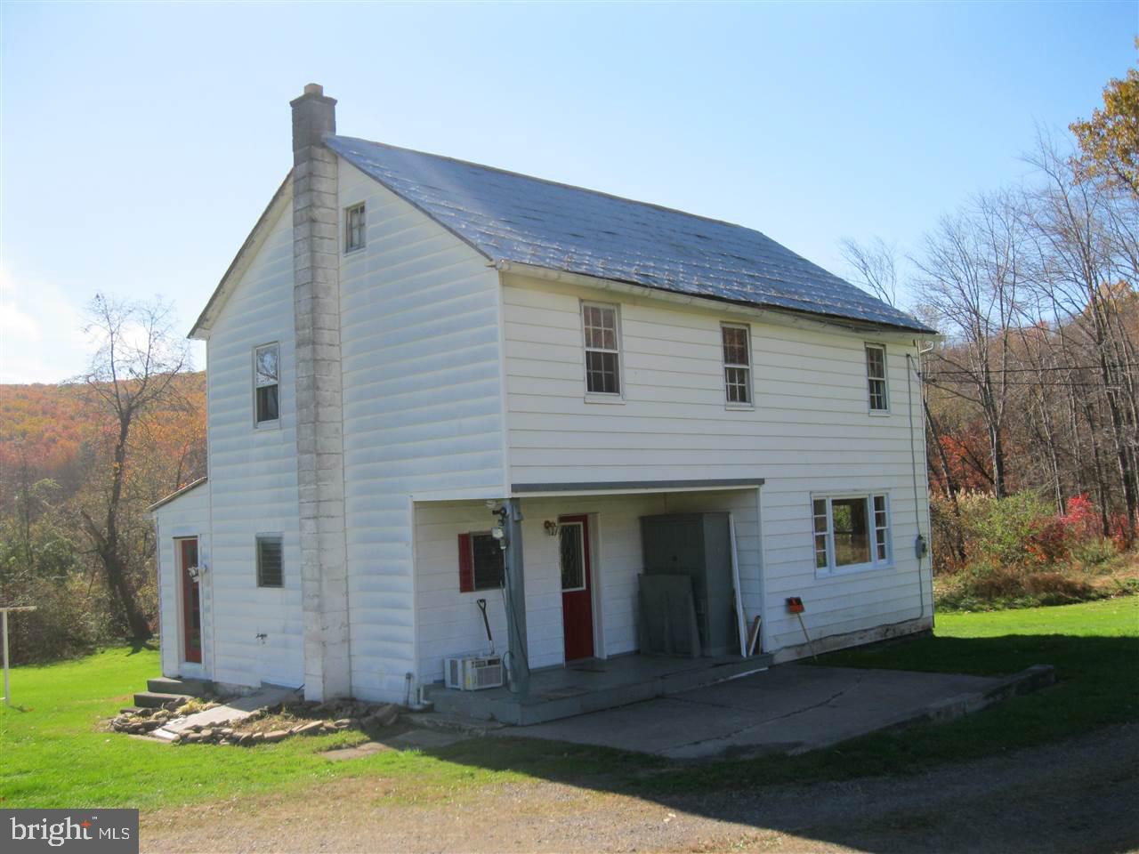 Farmhouse style home just shy of an acre of property. Includes Living room, eat-in kitchen, mud room, 1 bedroom and 1 full bath on the first level. The 2nd level has 2 bedrooms and storage. 2 sheds and a pond.