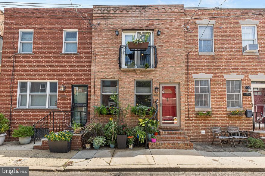 Welcome home to this lovely two bedroom, 2.5 bath home nestled on a quaint side street, just blocks away from Passyunk Avenue’s famous “10 Best Foodie Streets in America''. As you enter, you’ll be greeted by exposed brick, deep window sills, beautiful hardwood floors and an open concept layout with living room, dining area, powder room and kitchen. The kitchen offers a modern and cozy feel with its neutral color palette, granite counters, tile backsplash and thoughtful cabinet layout. A door off the kitchen leads to a natural oasis with a gorgeous trumpet vine providing a green canopy and your pup’s own private grass pad. Upstairs you will find two nice sized bedrooms, each with bamboo flooring, ceiling fan and their own ensuite full bathroom. The main bedroom has two closets and its bathroom boasts a new tub and a linen closet. The finished basement provides additional living space and is where you will find the washer and dryer. Other highlights include Central Air to keep things cool in the summer, new windows in the kitchen and bedroom, brand new tankless hot water heater and 7yr old roof. Located in the heart of Passyunk Square only steps away from the best dining and retail that Passyunk Square has to offer. Enjoy Rival Brothers, Green Eggs Cafe, Mighty Bread, Barcelona Wine Bar, Stogie Joe's Tavern, ReAnimator Coffee, Victor's Cafe, City Fitness, Columbus Square Park all steps away. Convenient to Broad Street Line, City Hall and all major highways.
