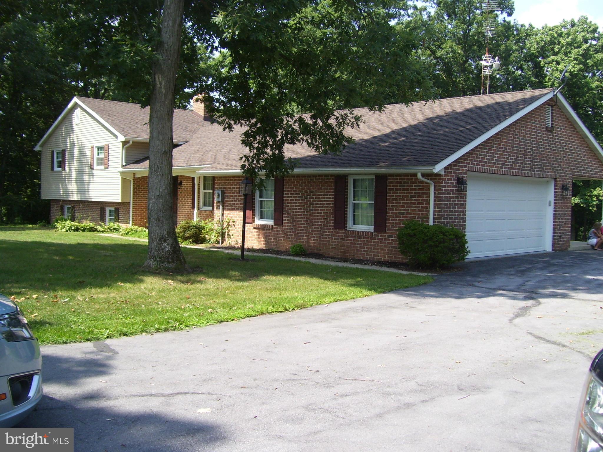 Lots of updates in this large home that sits on over 12 Acres.  Split level 3BR, 2.5Ba, lots of space, full partially finished basement, Three dif kinds of heating and central AC, very low electric bills, Large Utility Shed on property, New garage w storage above, and paved driveway.