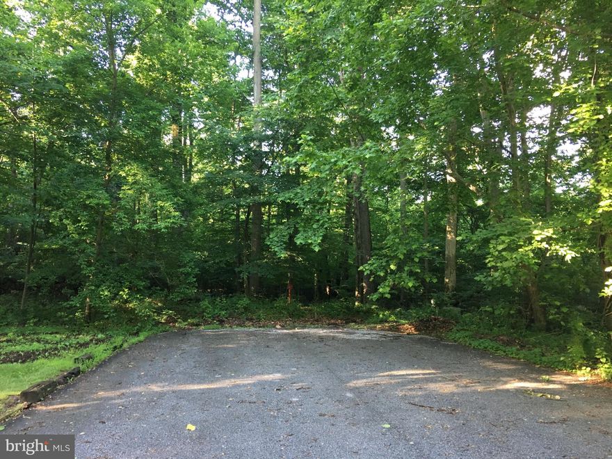 The best access point into the property is at  Laurel Drive at the end of Maple Drive. Just under 24 acres of wooded clean and green space. 1 parcel is 22 acres zoned agricultural the other  2  parcels .95 and .50 acres are zoned RS. Detached single family dwellings are allowed. Property starts at the end of Hilldale Road and runs the length of Maple Drive. There is another access point onto the property at the end of Maple Drive at Laurel Drive in a cul de sac where the additional 2 plots of land  are located.