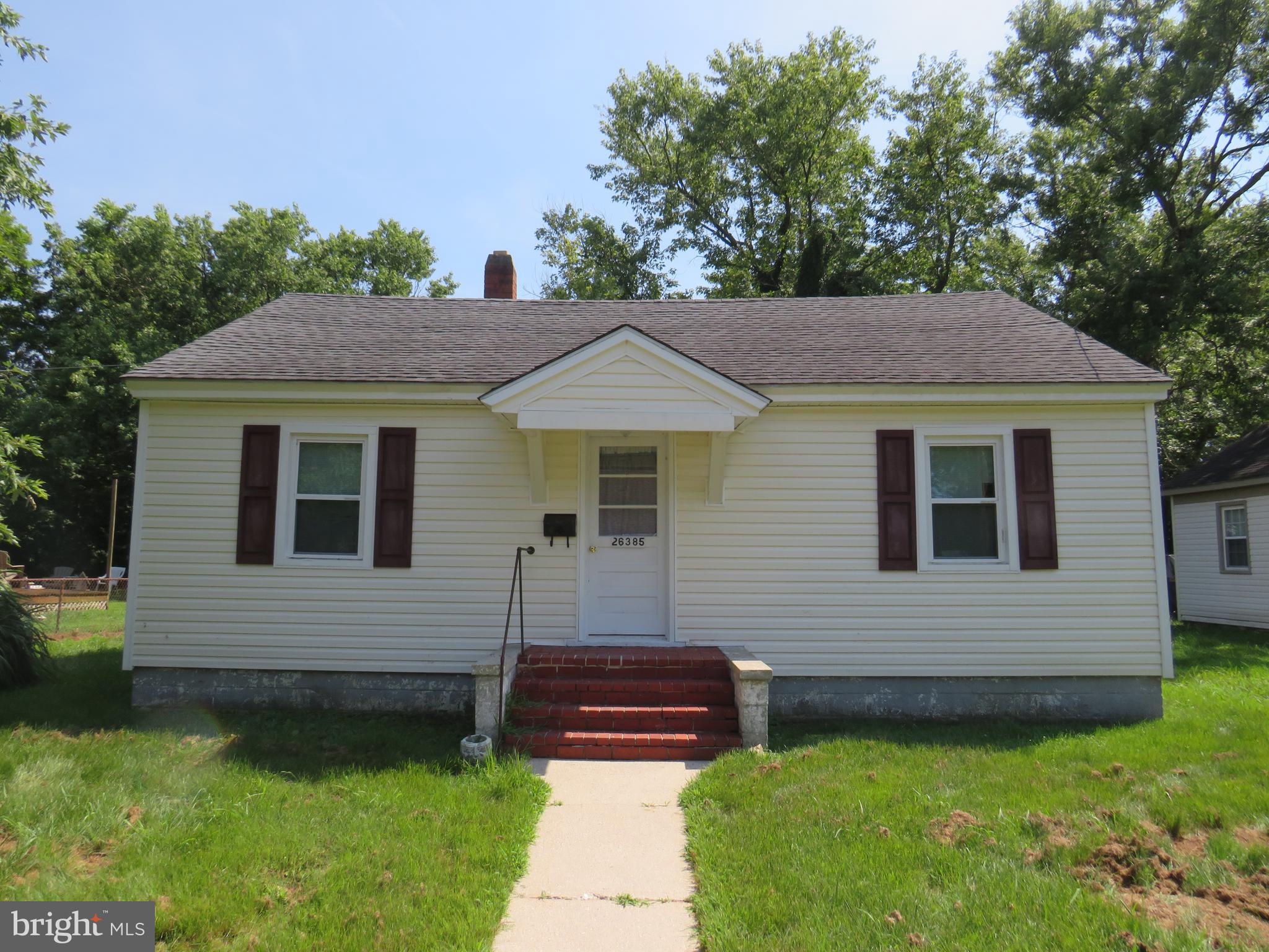 Cute little bungalow in a great location, outside city limits, but with public water and sewer, and near the City of Crisfield. Two bedrooms, one bath, kitchen, separate dining area and living room. Wood floors, replacement windows, electric baseboard heat. Large backyard. Needs some work. Sold "as is". No FHA or VA. Renovation loan, conventional or cash only.