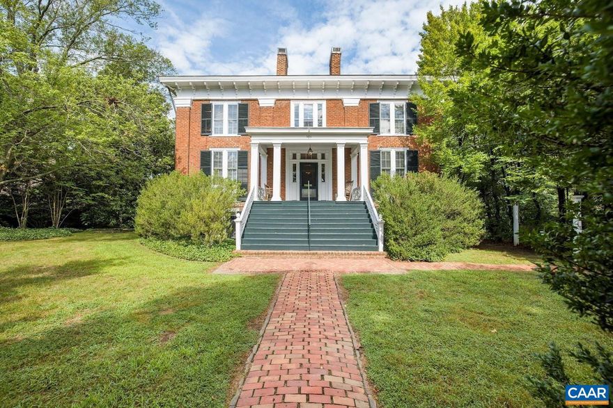 Step into a rare piece of Charlottesville history. Built in 1895, this Greek Revival home retains its original character with a central hall, grand staircase and striking brick fa�ade; features seldom preserved today. The property includes 4 bedrooms, 3.5 baths plus a flexible basement apartment and a separate 2-bedroom guest house. Nearly an acre of landscaped grounds provides space for entertaining or quiet retreat. Located just blocks from downtown and minutes from UVA, this residence blends historic charm with modern livability in one of the city?s most desirable neighborhoods.