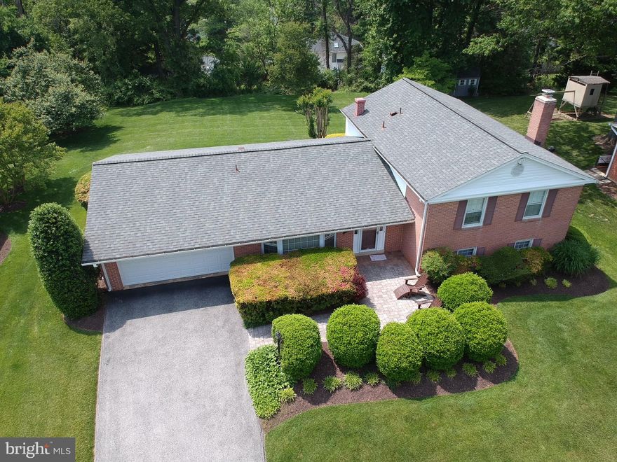 NEW ON MARKET! Updated and meticulously maintained, this beautiful home sits on a premium lot backing to mature trees and common area. Enter through the sun-filled foyer to fresh paint throughout the entire home! The foyer gives access to the large eat-in kitchen with bay window and built in bench seating perfect for casual summer meals. Access the oversized two car garage with ample storage/work space from the kitchen. Beyond the kitchen is the large dining room with newly refinished hardwood floors and double sliding glass doors leading to the the expansive private patio perfect for summer barbeques. The dining room opens into the living room with its gleaming hardwood floors and views of the professional landscaped backyard. The upper level encompasses newly refinished hardwood floors throughout as well as new light fixtures. The sizable primary bedroom has a large walk in closet with custom built-ins, plus an additional closet, oversized sink with shelving and separate water closet with shower. There are three additional well-sized bedrooms on the upper level as well as a refreshed hall bathroom with tub/shower combination with sliding glass doors. The lower level recreation area has new designer carpet and an exposed brick wall with wood burning fireplace. A fifth bedroom and half bath are just off of the family room as well as a large laundry area with extra refrigerator and freezer plus access to the side yard. The second lower level is huge with ample space for playing, gaming or anything one can think of! Conveniently located to shopping, restaurants and major commuter routes, this is the one you've been looking for.