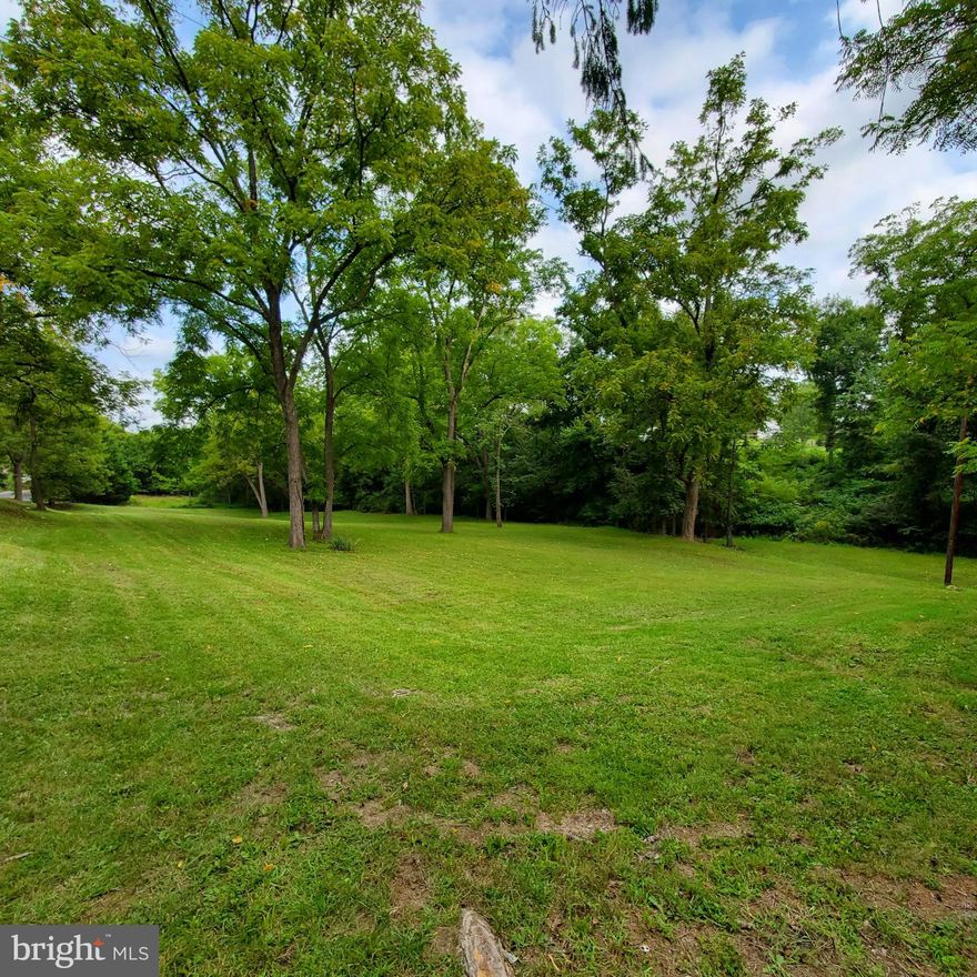 PREMIUM LOT with PARK-LIKE SETTING !! Thoreau Lovers - your very own nature reserve awaits You !!!    This 2 Acre rolling lot offers a Sunlit Meadow to build your Dream Home, Road Frontage, Mature Trees including several Walnut Trees, & a wet-weather stream at the rear of the property.  No HOA s - Only Restriction - No Mobile Homes.  There is an older building on the far west side of the lot that is uninhabitable -DO NOT ENTER.  Located approx  8 miles from I-81, 0.3 miles off Rt 9, Hedgesville School District, & just minutes from Shopping.  Here's your chance to own a piece of Tranquility!!