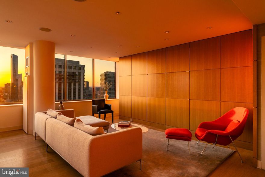 NEW LISTING! Welcome to Residence 2201, an exceptional, one-of-a-kind build by Shay Construction, located in The Rittenhouse Hotel and Condominium! Unmatched attention to detail and elevated finishes of this exquisite two bedroom, 2,5 bath home make it an architectural gem. Designed by Spence and Kass of Kass Associates and Ellen Magen Interior Design, the residence seamlessly combines luxury and comfort, inviting you to experience an unparalleled lifestyle in one of Philadelphia’s most desirable addresses. Step inside this 1,639 square-foot residence, and you'll immediately notice the superior craftsmanship and custom millwork. The open layout maximizes space and light, creating a bright and welcoming environment ideal for both relaxation and entertaining.  The home is wrapped in oversized windows that capture the most sensational views of the sunset. Unwind in the expansive living area, which flows into the dining room and the state-of-the-art kitchen with tasteful custom cabinetry by Fab Dubrunfaut, sleek countertops, and premium appliances. Retreat to the tranquil primary suite, with a gracious sitting area, a walk-in closet, and a span of windows that highlight magnificent sweeping views of the city skyline. The luxurious en-suite travertine bathroom offers a spa-like escape, complete with a bespoke dual vanity and a large steam shower. Located on the opposite wing of the home is a sizable second bedroom (southern exposure) with its own en-suite bathroom and ample closet space. The 2nd bedroom can easily function as a home office or den. A hall powder room is conveniently positioned for guests. There are Lutron shades integrated throughout including blackout motorized curtains in the primary suite. You'll love having 3 exposures, multiple corners, the split bedroom design and ending each night with a sunset. Enjoy five star amenities at The Rittenhouse,  including valet garage  parking (additional fee), a chauffeur town car, housekeeping services, 24 hour lobby attendant, concierge, room service, pool, fitness center and luxury spa. Scarpetta, Lacroix restaurant and the Library Bar are also all at your doorstep! Pet friendly