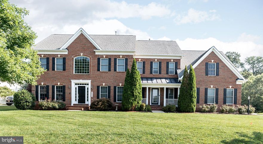 This spectacular home located in the lovely community of Greenspring at Compass Pointe is an absolute must see! It sits on 1 acre nestled close to the golf course, community pond, and is an easy drive to the water front, local marinas, and restaurants. This home has everything you need! It's open and modern floor plan is breath taking! The family room boasts grand 20 foot ceilings, gorgeous stone fireplace and surround sound system. In addition the main floor has a formal living room, dining room, office/den, full bath, eat-in kitchen, and mud/laundry room. The kitchen is fabulous with newer appliances, double oven, cooktop, beautiful island, fabulous walk-in Butler's pantry and desk area. The mud/laundry room is located off the kitchen with entry from the front of the house and garage. There's an extra large 3 car garage with gleaming epoxy floors and plenty of off floor storage. Off the kitchen you'll find a beautiful four season room that leads out to a maintenance free deck and stone patio with built in fire pit. The luxurious master suite on the top floor has a master bath, sitting room, and 2 walk in closets. The master bedroom has a gorgeous wall of windows looking out over the wonderfully maintained fenced in backyard with automated irrigation system and Amish built 10'x14' shed. In addition to the master suite, the top floor has a guest room with private full bath and a Jack and Jill bathroom with adjoining bedrooms. The basement is fully finished with 1 bedroom, full bath, utility room, wet bar, pellet stove, and bonus exercise/storage room. There are French doors that allow walk out to the backyard and provide lots of natural light. This lower level is great for entertaining! Or could be used as an in-law suite! There are true hardwood floors throughout, central vacuum throughout, and dual zoned Carrier HVAC for heating and cooling. On top of all this, it's the driest house in the neighborhood thanks to a foundation drainage system. This house has so much to offer! Many items convey! Definitely a must see!