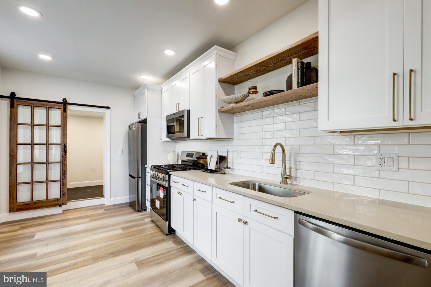 This home is an extraordinarily beautiful renovated home!! Tucked away on a quiet street in Lancaster City, yet minutes to everything! This charming straight-through layout features a spacious living room and a dining area with a cozy fireplace accent. The showstopper kitchen includes bar seating, quartz countertops, gold fixtures, and all-new cabinetry—perfect for entertaining. A convenient first-floor laundry and access to a private backyard add everyday ease.
Upstairs, you’ll find a stunning primary suite complete with a walk-in closet and a luxurious tile shower with exposed brick accents. Two additional bedrooms and a full bath provide plenty of space for family, guests, or a home office. Enjoy easy on-street parking and a prime location—just 5 minutes from downtown Lancaster and the F&M campus
